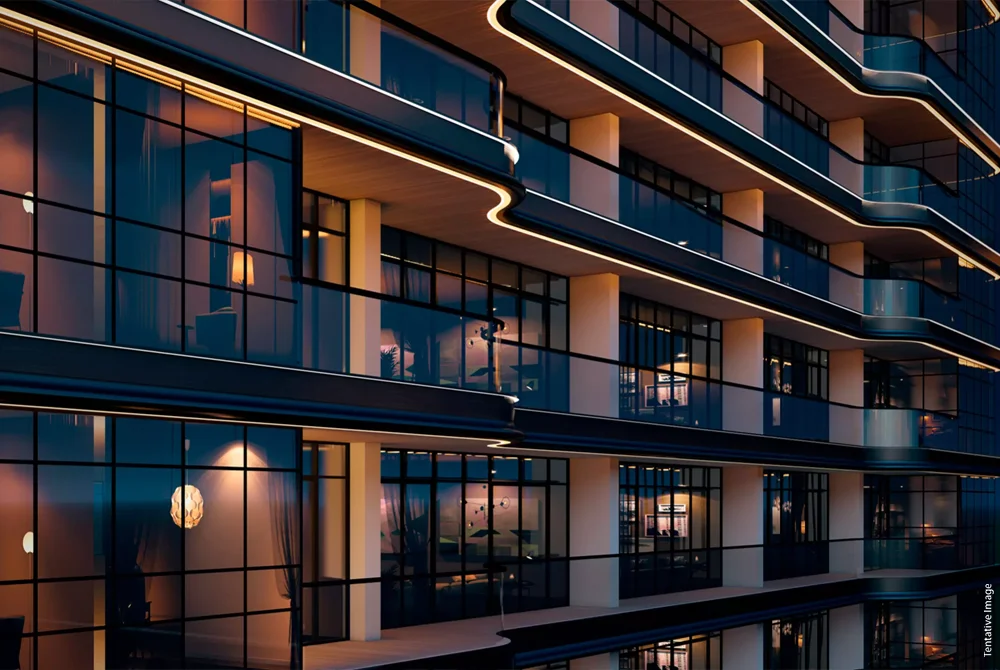 Modern luxury glass tower reflecting sunlight and city skyline