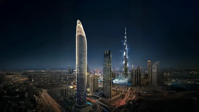 Illuminated luxury tower glowing against the night cityscape