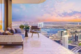 Luxury bedroom with panoramic outdoor view of surrounding towers